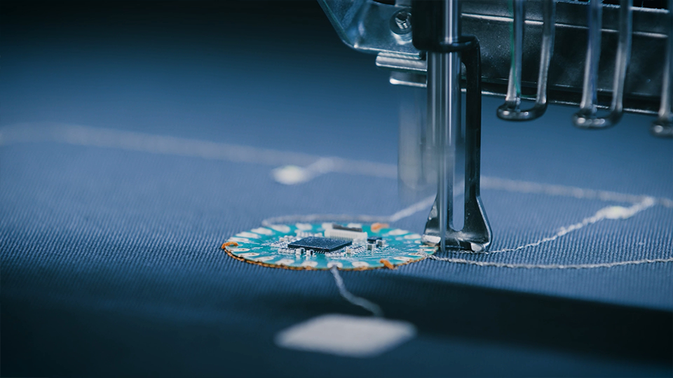 Smart textiles - process of electrically connecting a PCB to fabric with an embroidery machine