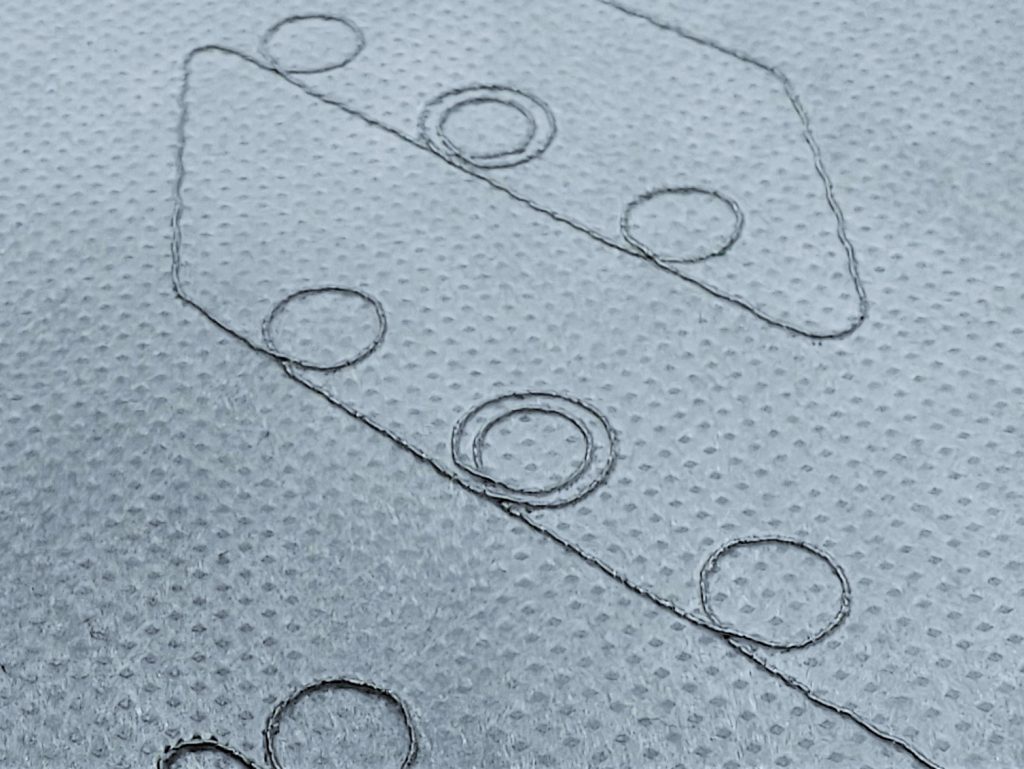 Close-up photo of embroidered RFID tag booster antennas