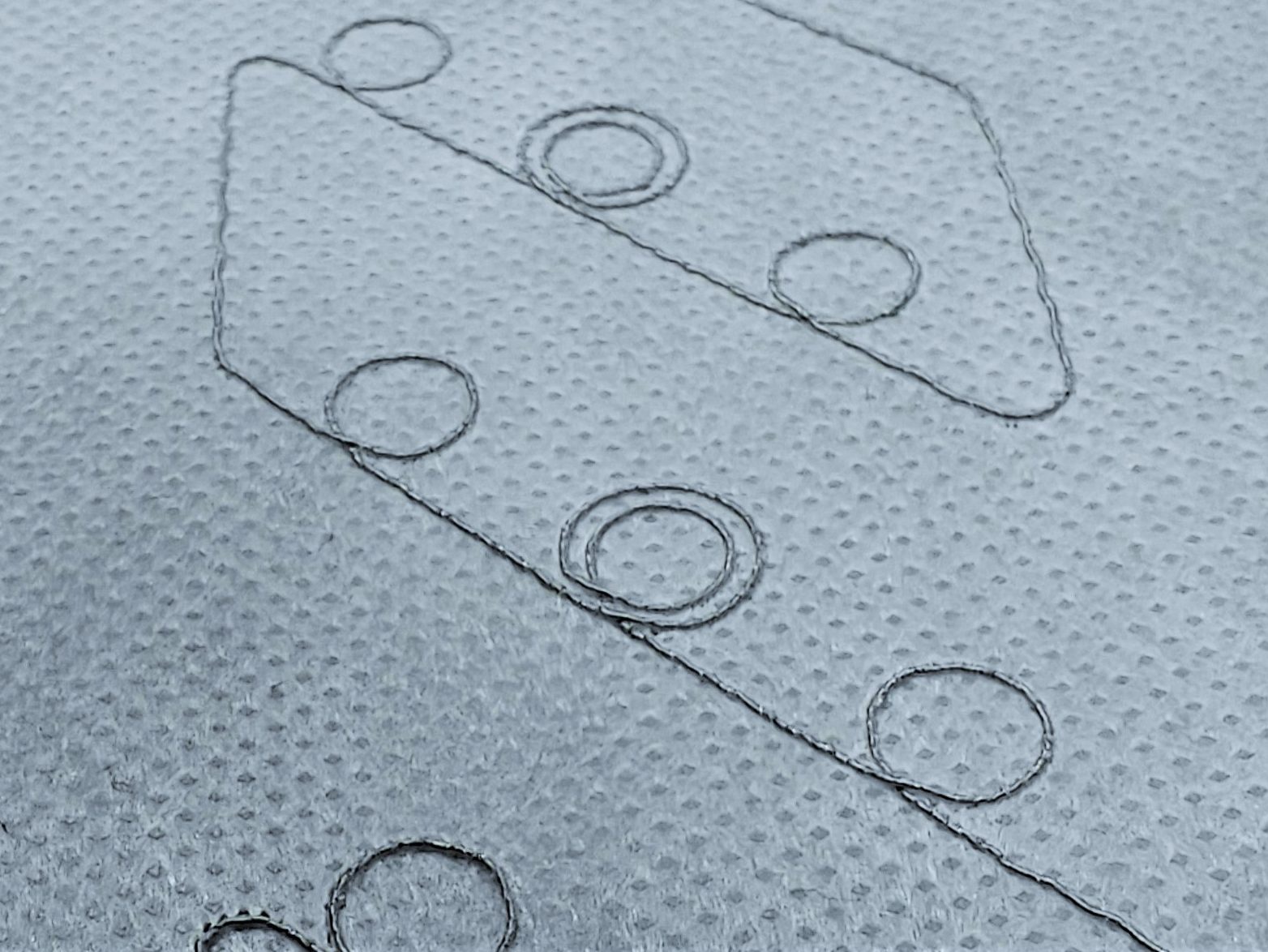 Close-up photo of embroidered RFID tag booster antennas