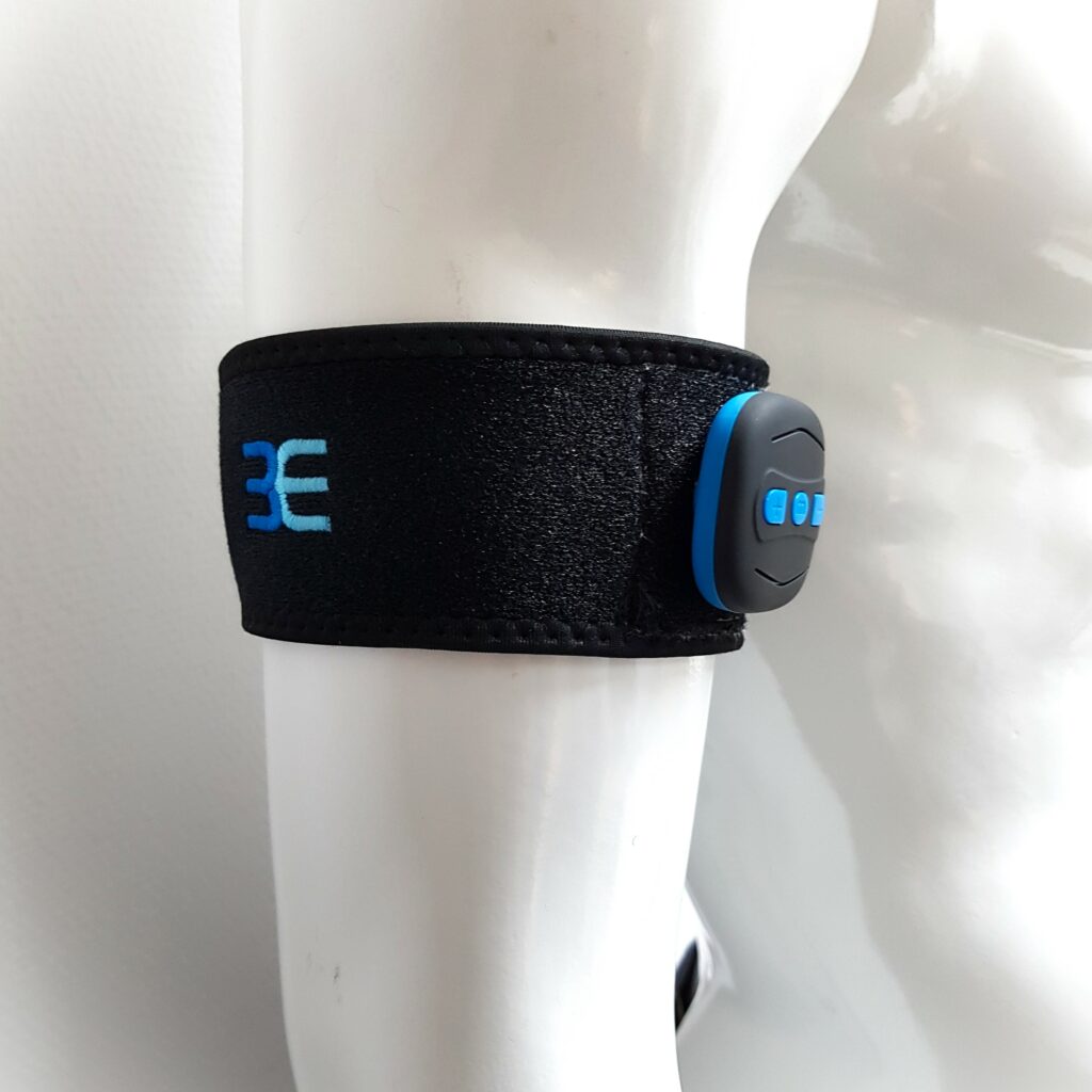 3E EMS arm cuff prototype worn on athlete’s arm with moss-embroidered electrodes and controlling device for muscle stimulation