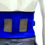 EMS back belt with embroidered textile electrodes worn during rehabilitation therapy
